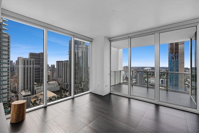 unfurnished room with expansive windows