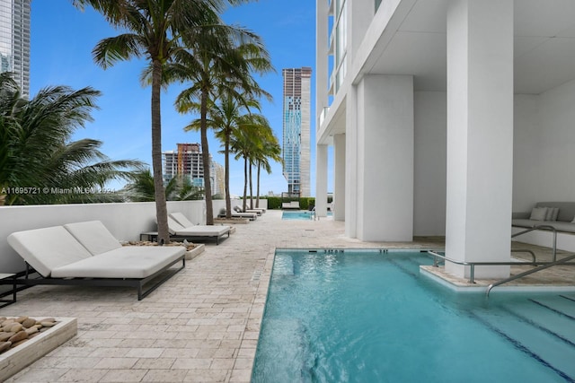 view of swimming pool with a patio