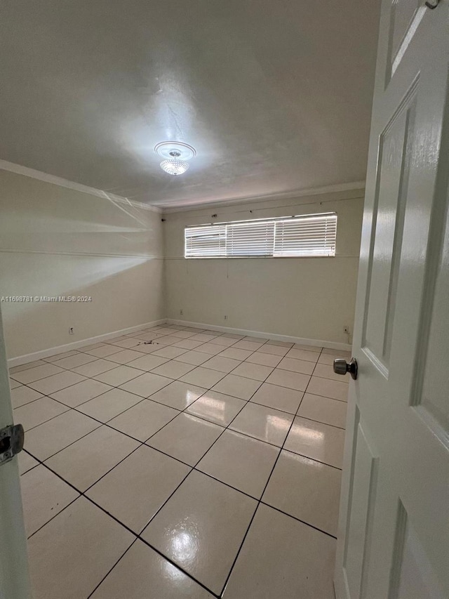 spare room with light tile patterned floors