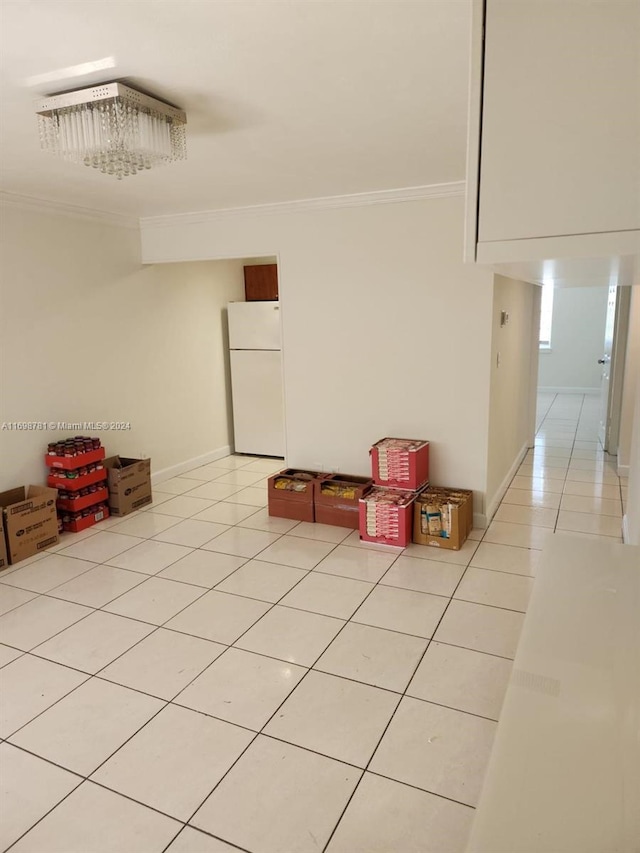 interior space featuring light tile patterned floors and crown molding