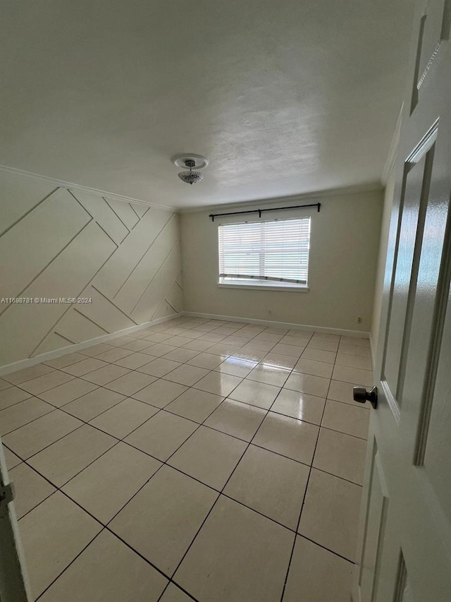 unfurnished room with light tile patterned floors