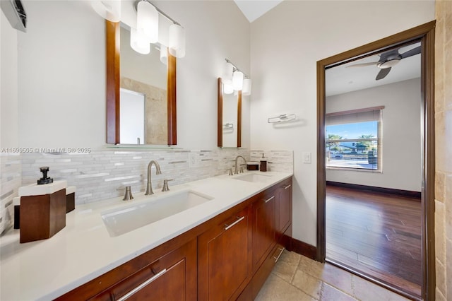 bathroom with tasteful backsplash, vanity, and ceiling fan