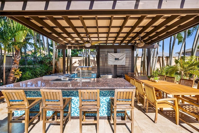 view of patio featuring a pergola, area for grilling, and ceiling fan