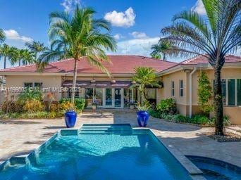 back of house with a patio