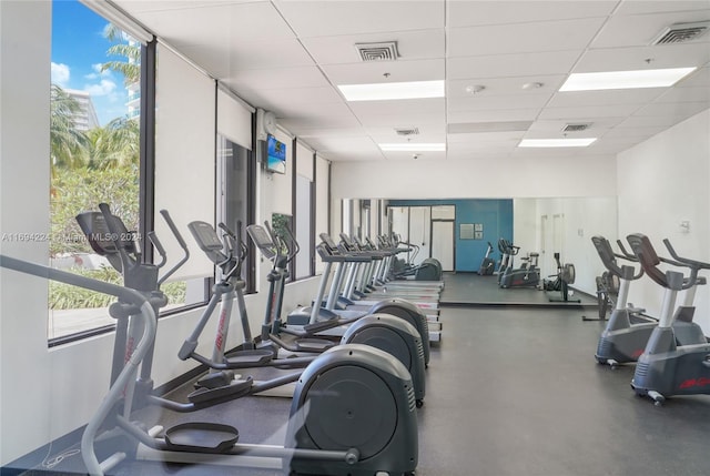 gym featuring a drop ceiling