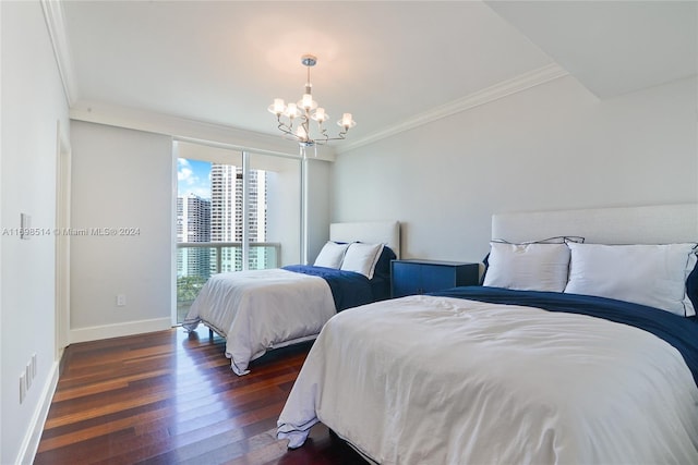 bedroom with dark hardwood / wood-style flooring, crown molding, and an inviting chandelier