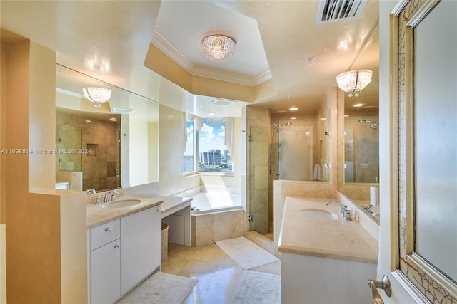 bathroom with tile patterned flooring, vanity, independent shower and bath, and an inviting chandelier