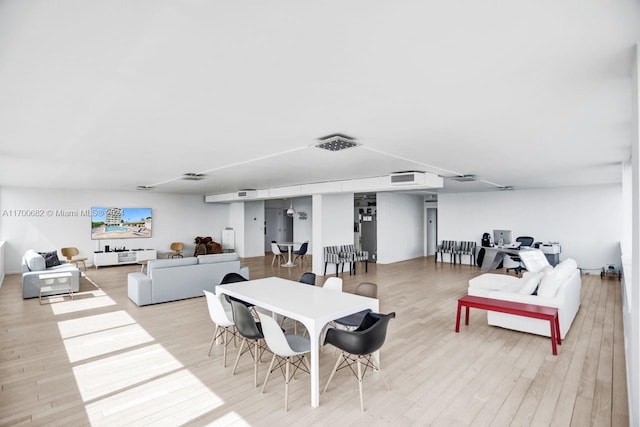 dining room featuring light wood-type flooring