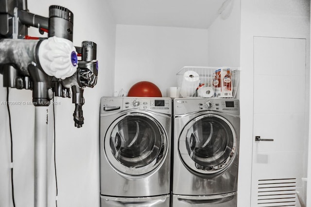 laundry area with independent washer and dryer