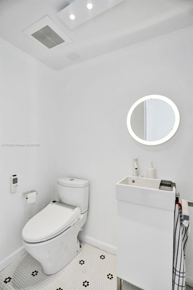 bathroom featuring tile patterned flooring and toilet