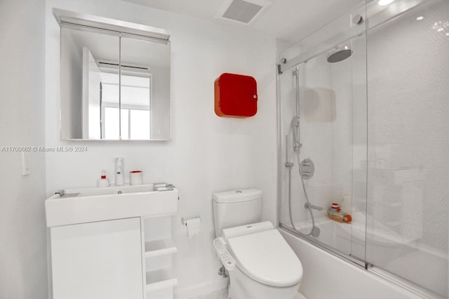 full bathroom featuring vanity, toilet, and enclosed tub / shower combo