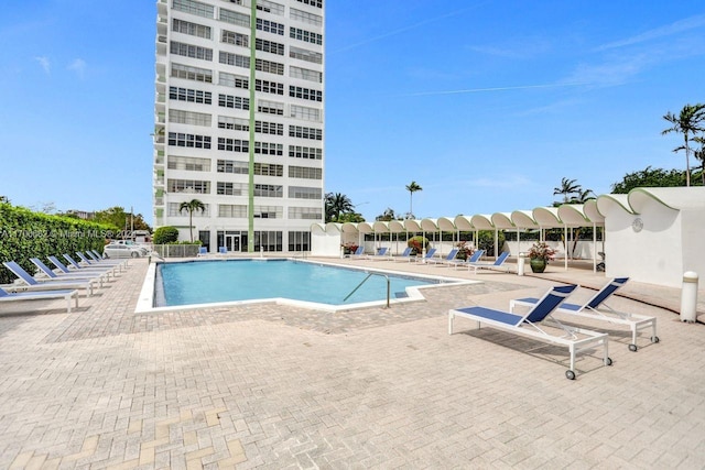 view of swimming pool with a patio area