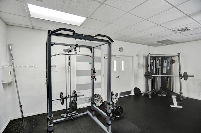 workout area with a drop ceiling