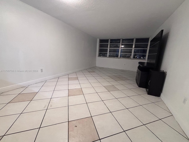 1351 NE Miami Gardens Dr Unit 604E, Miami, FL 33179 - unfurnished living room featuring light tile patterned flooring
