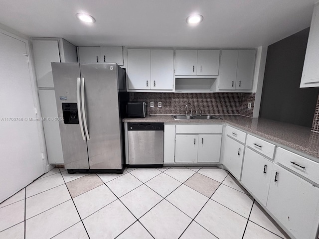 1351 NE Miami Gardens Dr Unit 604E, Miami, FL 33179 - kitchen with appliances with stainless steel finishes, a sink, tasteful backsplash, recessed lighting, and light tile patterned floors