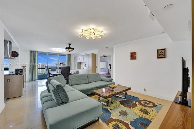 living room featuring light tile patterned floors and floor to ceiling windows