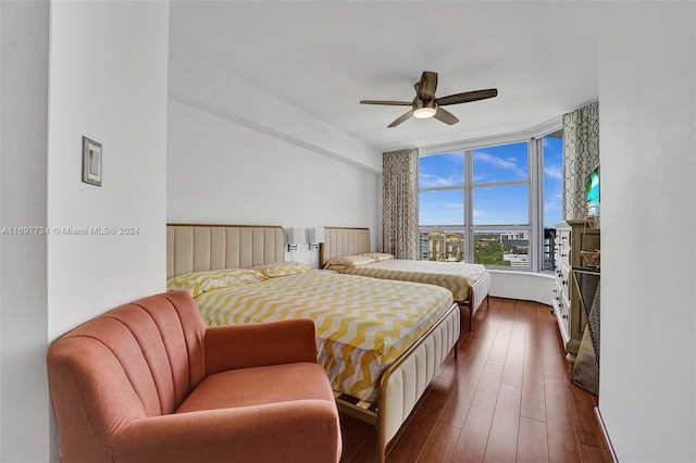 bedroom featuring ceiling fan and dark hardwood / wood-style flooring