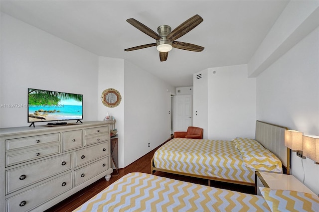 bedroom featuring ceiling fan and dark wood-type flooring