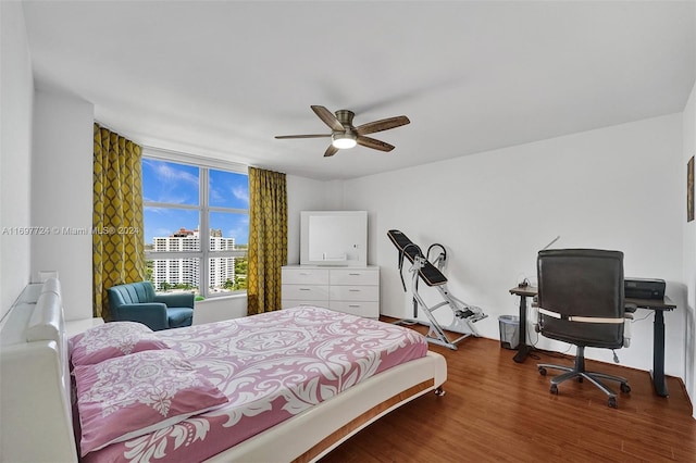 bedroom featuring ceiling fan and hardwood / wood-style flooring