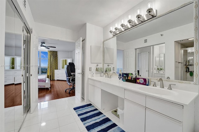 bathroom with tile patterned flooring, ceiling fan, and vanity