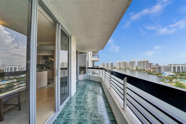 balcony featuring a water view