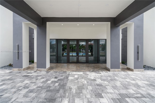 entrance to property featuring french doors