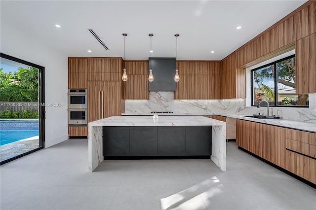 kitchen with pendant lighting, backsplash, double oven, and sink