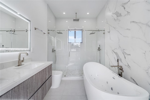 full bathroom featuring tile patterned floors, vanity, toilet, and shower with separate bathtub