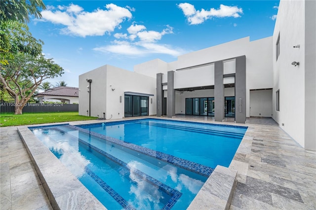 view of pool with a yard and a patio