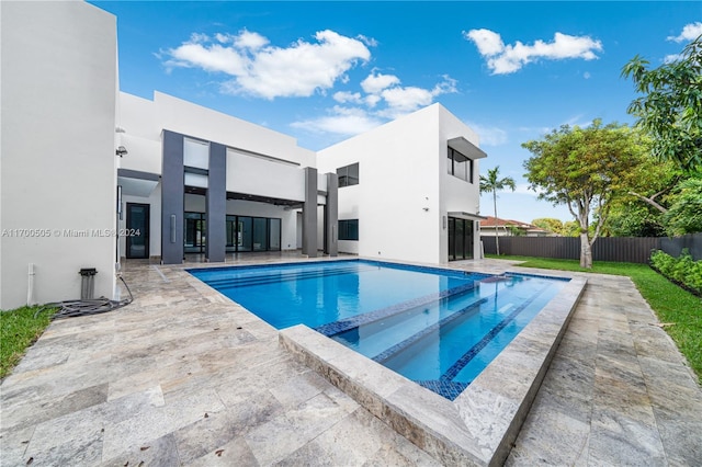 view of pool featuring an in ground hot tub and a patio area