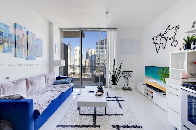 living room with light tile patterned floors and a wall of windows