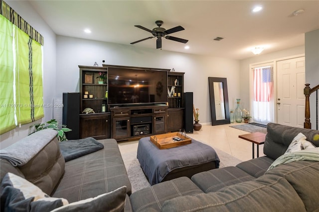 tiled living room featuring ceiling fan