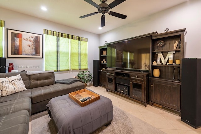 living room featuring ceiling fan and light tile patterned floors