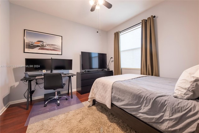 bedroom featuring ceiling fan and dark wood-type flooring