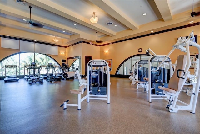 exercise room with ceiling fan