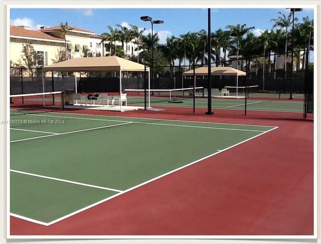 view of sport court with basketball hoop