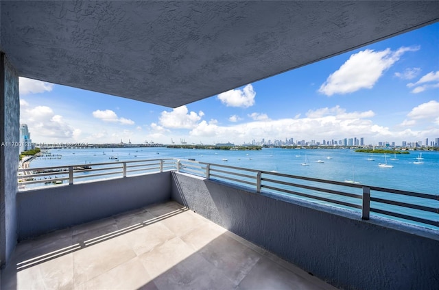 balcony featuring a water view