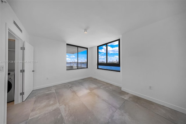 unfurnished room featuring washer / clothes dryer