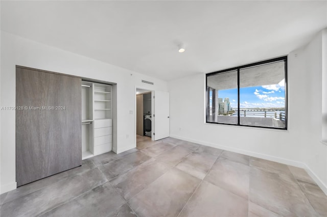 unfurnished bedroom with a closet