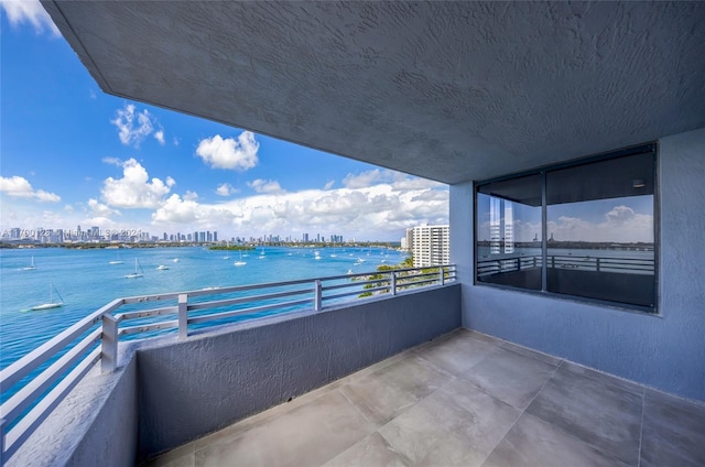 balcony featuring a water view