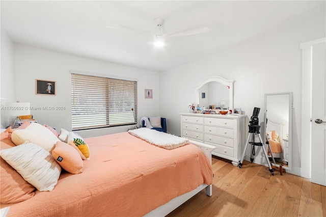 bedroom with ceiling fan and light hardwood / wood-style flooring