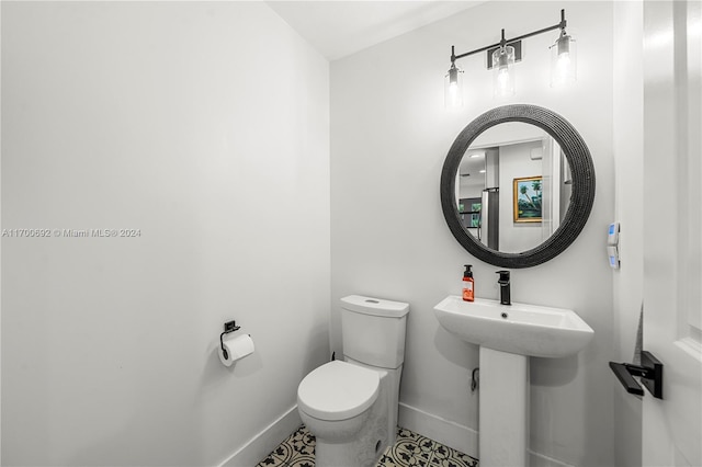 bathroom with tile patterned floors and toilet