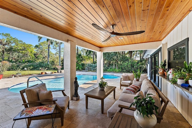 exterior space with ceiling fan and an outdoor living space