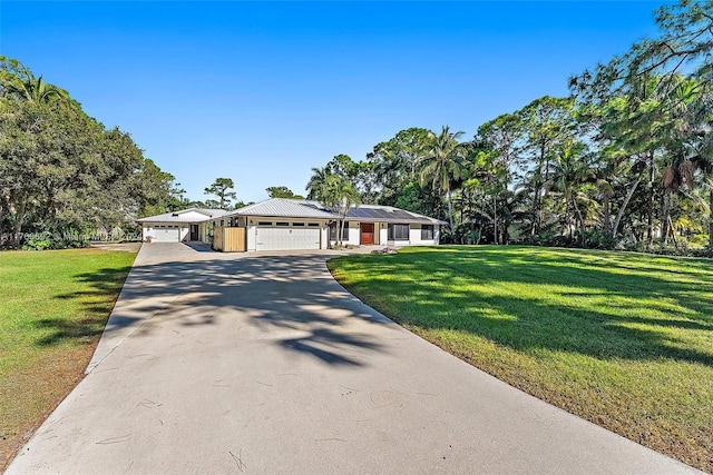 ranch-style house featuring solar panels, a garage, and a front lawn