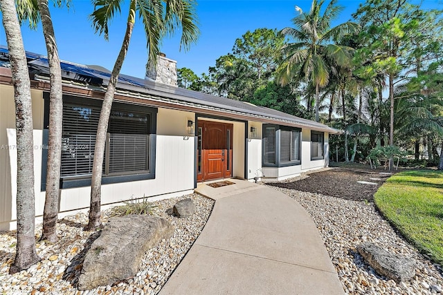 view of front of home with solar panels