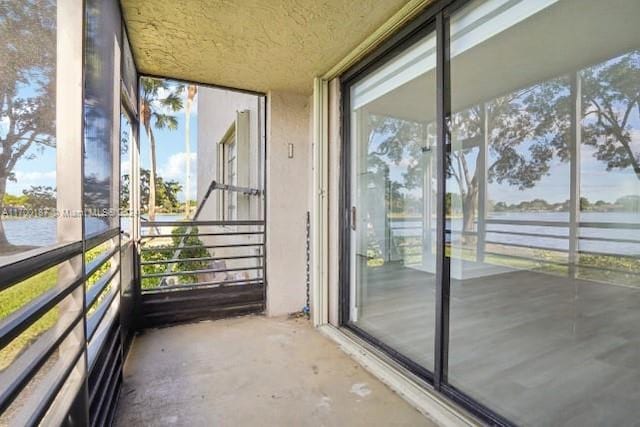 balcony featuring a water view