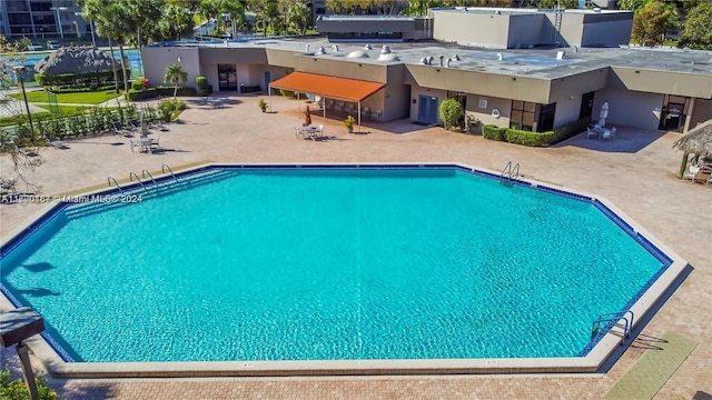 view of swimming pool featuring a patio