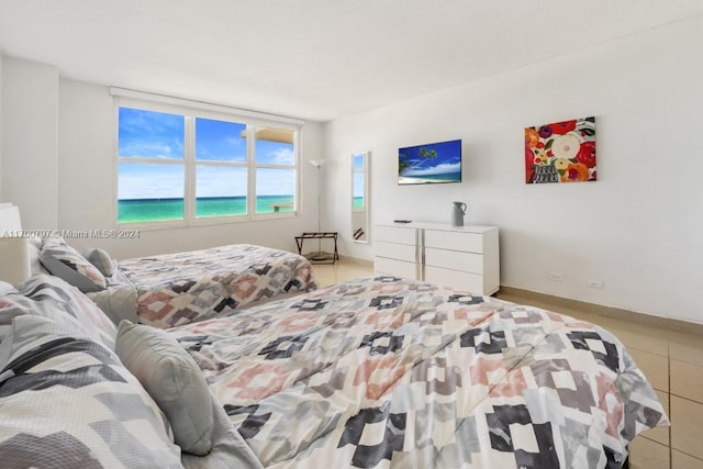 bedroom with light tile patterned flooring