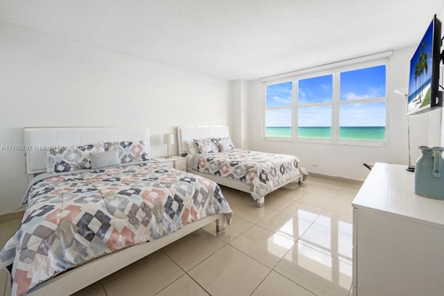 bedroom with light tile patterned floors