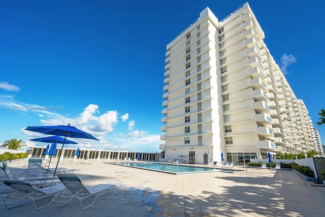 view of swimming pool with a patio area